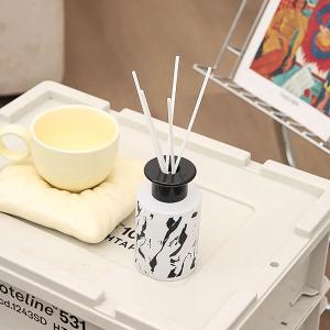 Fragrance diffuser with sticks